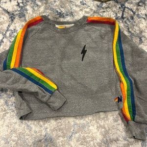 Aviator nation grey with rainbow stripes down sleeves and small black bolt